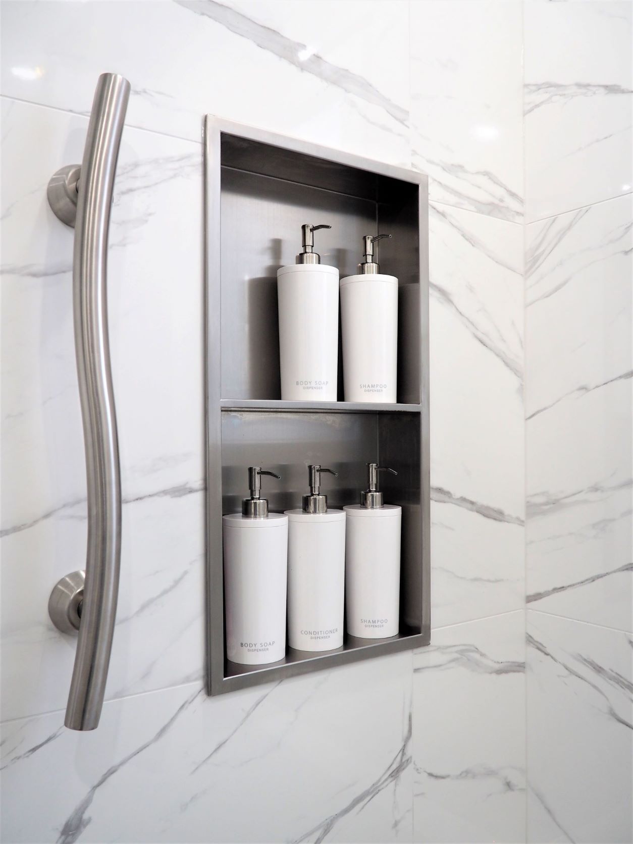 Stainless Steel Wall Niche organizes toiletries, Grab Bar provides safety